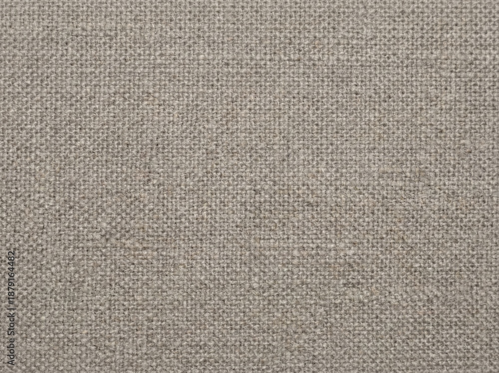 Fototapeta premium A close-up of a textured gray fabric surface, ideal for backgrounds and design projects.