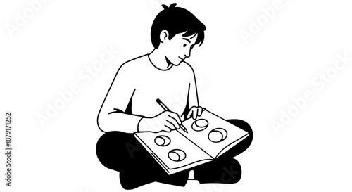 Child sitting cross-legged drawing circles in a sketchbook.