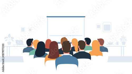 Large group of individuals seated with their backs to the viewer, attentively facing a blank projection screen in a modern presentation room, awaiting information.
