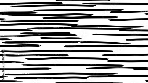 Abstract black lines pattern on a simple surface viewed from directly above showcasing dynamic strokes and varied line lengths in a contemporary art piece