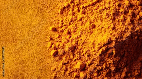 Turmeric Powder Texture Background in Warm Golden Yellow 