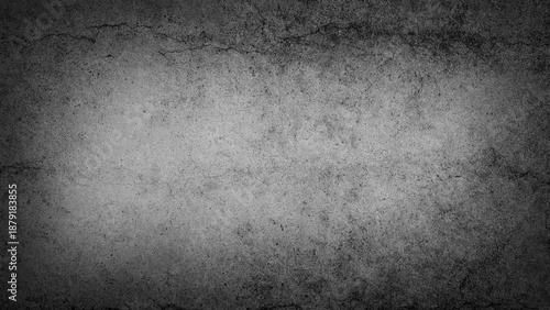 Grunge textured cracked concrete wall in monochrome tones