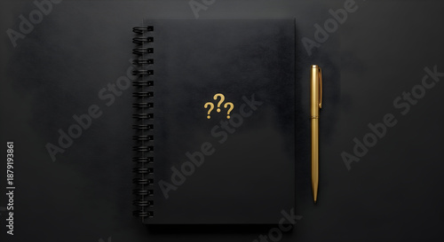 Black notebook with golden question marks and pen on dark background.