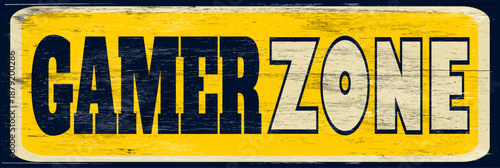 Aged and worn gamer zone sign on wood