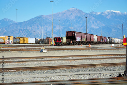 Foto Railroad yard freight railcars and track infrastructure