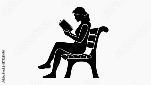 Woman sitting on chair reading book in quiet moment
