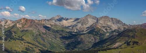 This stunning Elk Range Mountain panorama features Colorado 14ers Capitol Peak and Snowmass Mountain rising above lush green Lead King Basin.