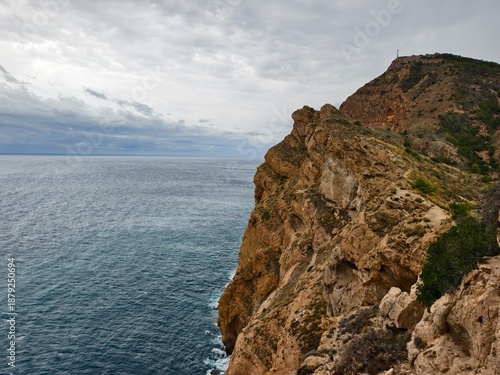 Konstfotografi rugged cliffs meet turquoise waters, vast rocky cliff over vibrant turquoise oce