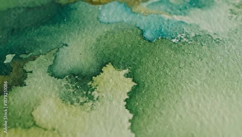 Close Up of Vibrant Green and Turquoise Watercolor Textures with Fluid Shapes and Shimmering Depths
