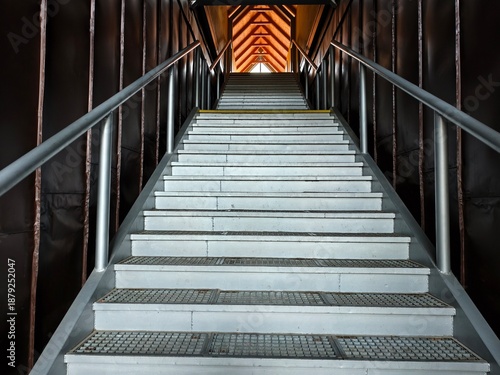 metal staircase in industrial setting, industrial corridor with metal staircase and dramatic