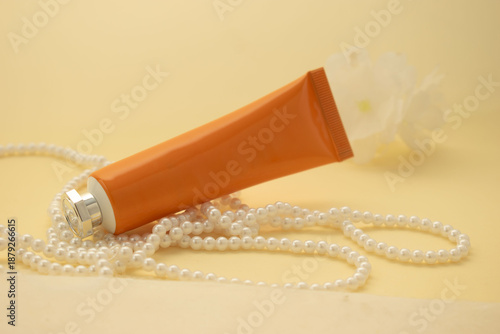 Minimal cosmetic packaging mockup with white boxes and luxury pearls on pastel background