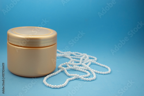 Minimal cosmetic packaging mockup with white boxes and luxury pearls on pastel background