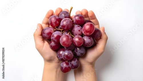 flat lay hand holding grapes on white background