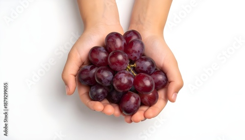 flat lay hand holding grapes on white background