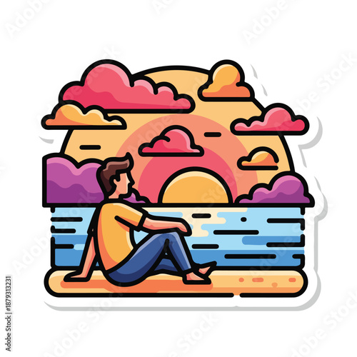 A man sitting on beach watching sunset