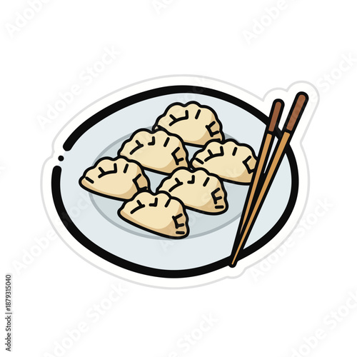 A plate of dumplings with chopsticks