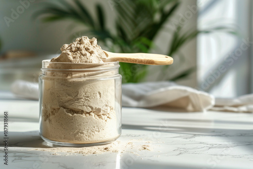 Fine whey protein powder in glass jar for fitness and health