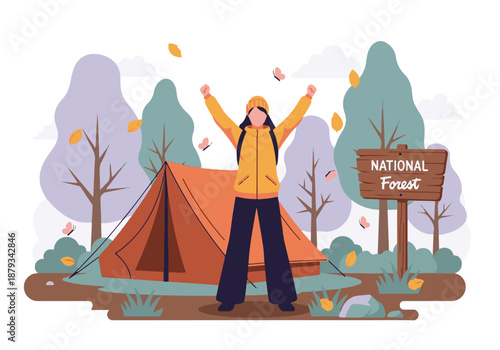 Joyful woman camping and exploring in an autumn national forest