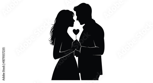 A romantic couple embracing tenderly holding a heart symbol between them depicted as a striking silhouette