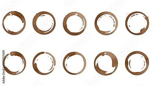 Collection of ten brown coffee cup stains forming perfect circles on a white background.