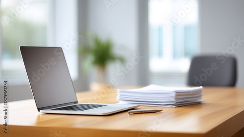 Wallpaper Mural Modern workspace with laptop and stacks of paperwork on wooden desk in bright office environment, ideal for business and productivity related themes Torontodigital.ca