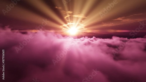 Bright sunburst with radiating rays piercing warm sky above a vibrant pink cloudscape