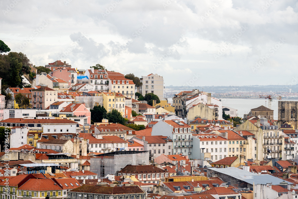 Fototapeta premium Alfama rooftops leading toward the Tagus River