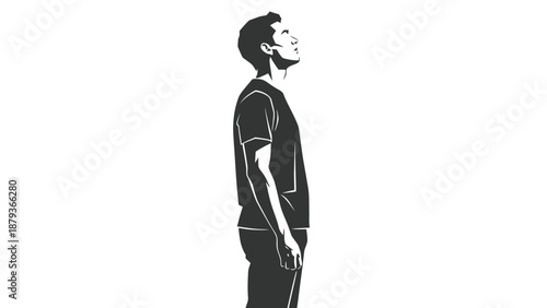 A man in a t-shirt and jeans stands looking upwards against a white background.