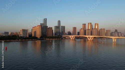 Wallpaper Mural Guangzhou, China – December 15, 2025:
Aerial view of Guangzhou city skyline at sunset, featuring the Pearl River (Zhujiang River) and Pazhou Bridge. Panoramic drone shot of modern high-rise buildings, Torontodigital.ca