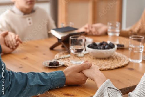 Muslim family praying befor...