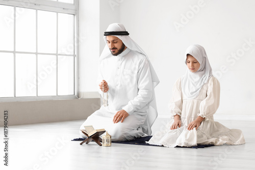 Muslim father with his daug...