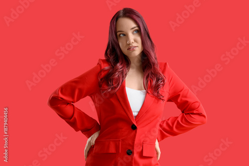 Young woman with red hair o...