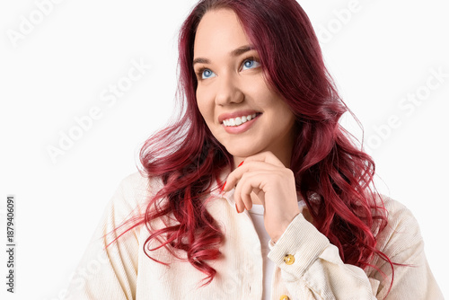 Young woman with red hair o...