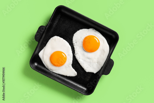 Frying pan with tasty fried...