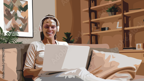 Female freelancer working remotely on laptop while sitting on couch at home with headphones on in a cozy living room with remote work and work from home