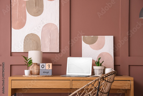 Stylish workplace with mode...
