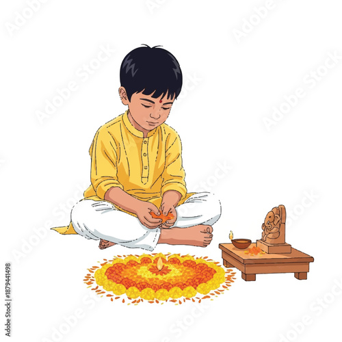 Young Indian boy celebrating Vasant Panchami with Ganesha idol and marigold flowers