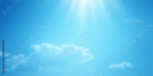 Beautiful blue sky with white clouds and bright sun creating a clear cloudscape view of the summer atmosphere in nature's high heaven
