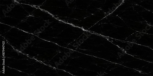 Vintage grunge black paper texture with a dark marble pattern and macro spider web details on a weathered leather surface backdrop