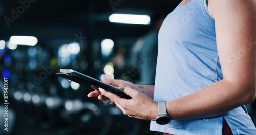 Photos Woman, hands and scroll in gym with tablet, workout research and sign up for personal trainer program