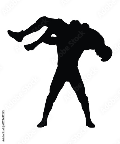 Man lifts woman in silhouette