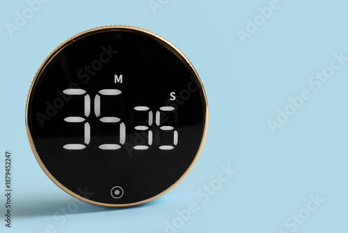 Modern kitchen timer on blu...