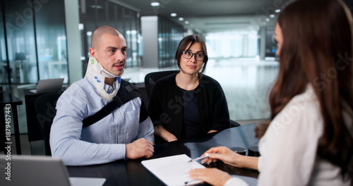 Фотография Happy Worker Smiles After Receiving Injury Claim Settlement