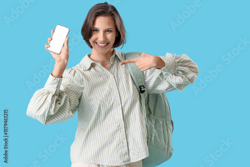 Happy female student with b...