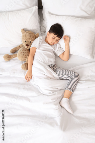 Sleeping little boy hugging...