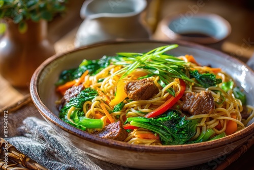 Colorful Asian Inspired Noodle Dish with Tender Beef, Fresh Vegetables, and Vibrant Greens Served in a Rustic Bowl on a Wooden Table