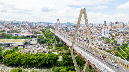 An aerial view of Pereira Bridge, showcasing its modern architecture and surrounding urban landscape in Risaralda, Colombia.