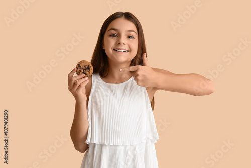 Happy little girl holding s...
