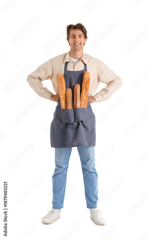 Fototapeta premium Handsome young man with fresh baguettes isolated on white background