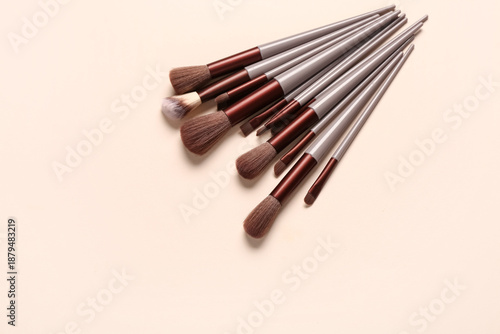 Makeup brushes on pink back...